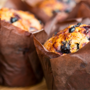 Delicious gluten-free and dairy-free blueberry muffins with fresh blueberries.