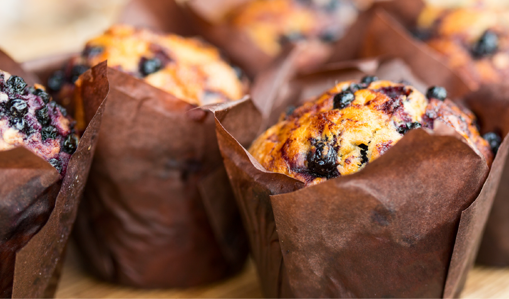 Delicious gluten-free and dairy-free blueberry muffins with fresh blueberries.