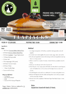 Gracious Bakers gluten-free and dairy-free flapjacks stacked on a plate with a drizzle of raw honey and fresh berries.