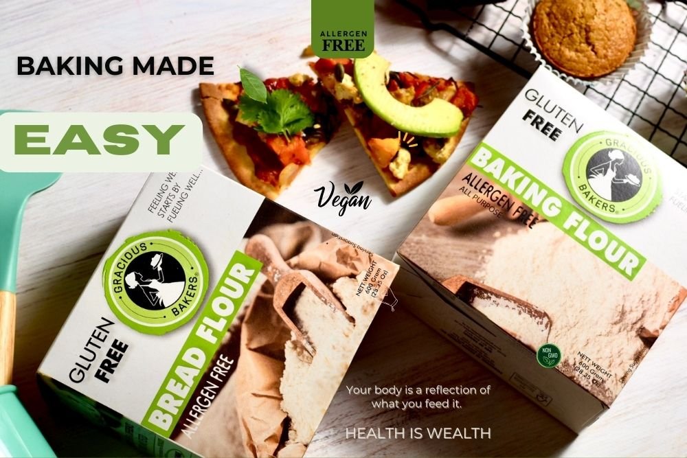 Gracious Bakers Allergen-Free, 100% Gluten-free, dairy-free, plant based, Non-Gmo, Vegan Bread Flours in a box, surrounded by freshly baked loaves of bread.
